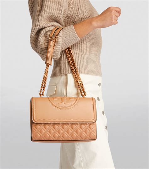 tory burch flat shoulder handbags.